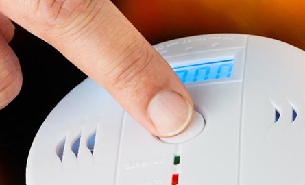 Pressing smoke alarm button